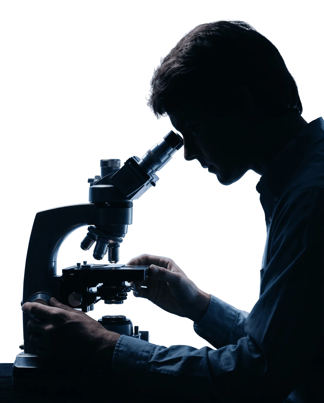 An analyst at a microscope, in silhouette